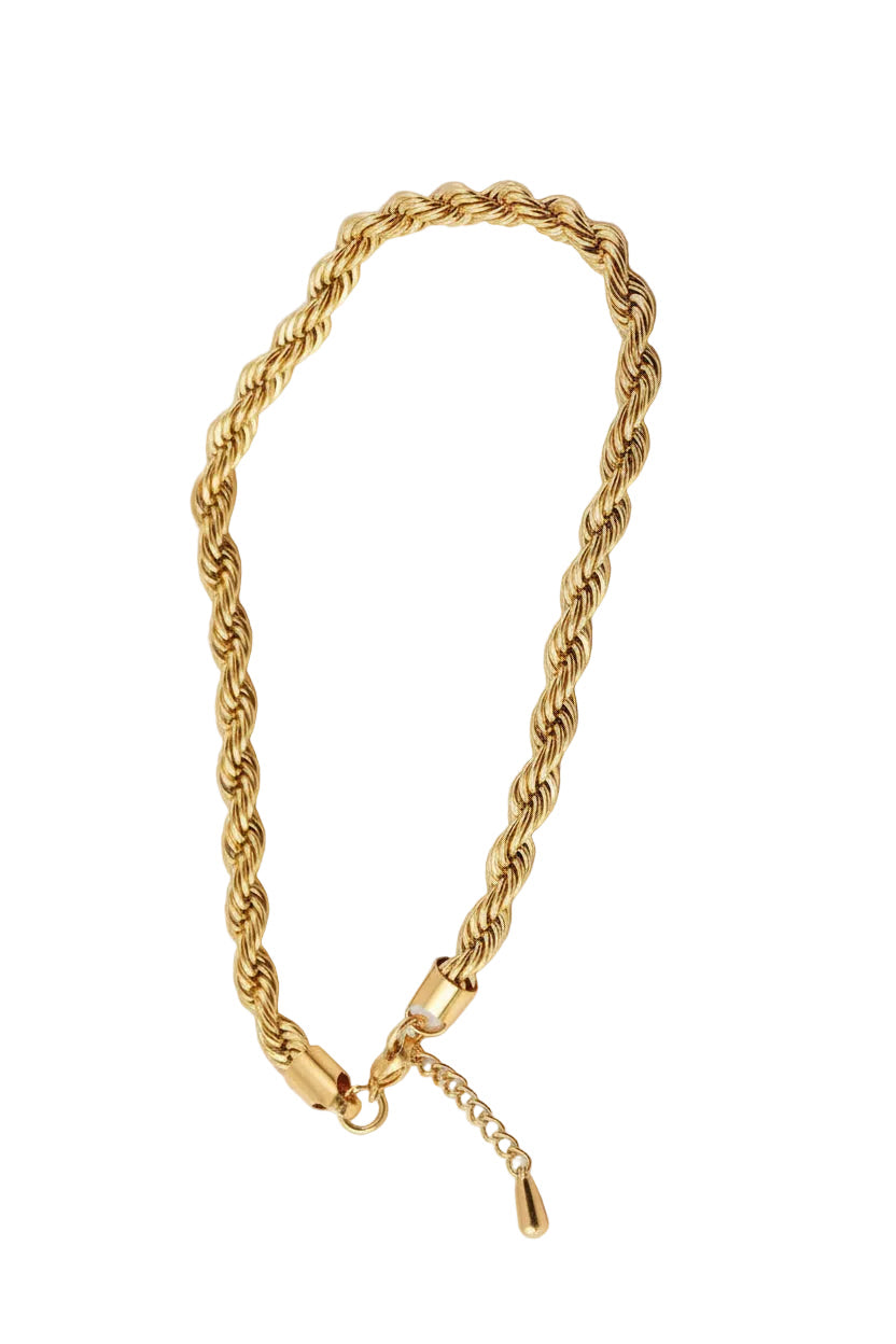 Gold rope chain bracelet on a white background